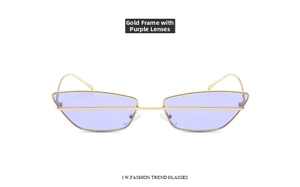 Detailed view of cat eye sunglasses with gold metal frame and transparent purple lenses