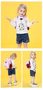 Detail of pink unicorn kids backpack with 3D rainbow horn and breathable red mesh pocket
