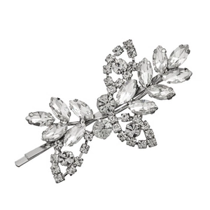 Macro detail of silver leaf and flower hair pin with sparkling rhinestone inlay