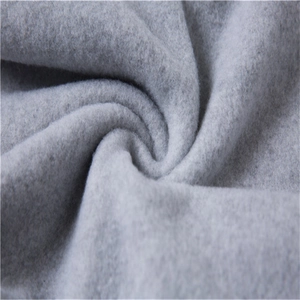Close-up showing the soft fleece texture and thick fabric of light gray sweatpants