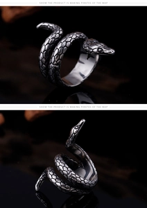 Macro shot of vintage silver cobra ring showing realistic snake scale textures and punk design
