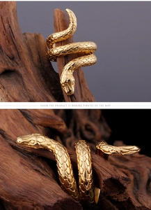 Detail view of gold cobra snake ring featuring intricate scales and punk vintage textures