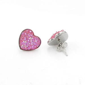Detail of pink druzy heart earrings with silver metal frame and butterfly backs