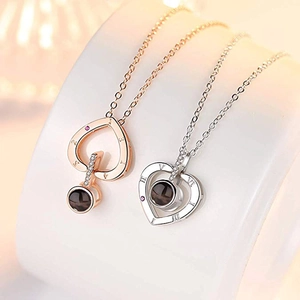 Projection heart necklaces in rose gold and silver finish with Roman numerals and crystals