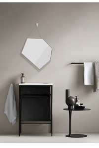 Detail view of the geometric hexagonal gold frame and sturdy metal chain for wall mounting
