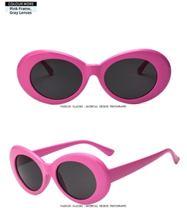 Detail of pink oval sunglasses with grey lenses and vintage retro plastic frames