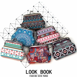 Group of vintage canvas coin purses featuring ethnic patterns and metal clasp closures