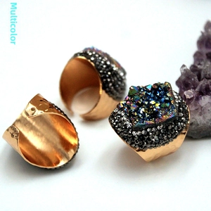Detail view of adjustable gold ring featuring vibrant multi-color druzy agate crystal stone