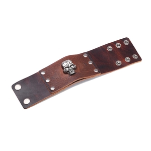 Vintage brown leather cuff bracelet with silver skull charm and adjustable snaps