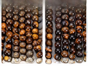 Macro shot comparing the texture and silk luster of 8mm natural tiger eye stone beads