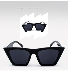 Detail einer quadratischen Cat-Eye-Sonnenbrille mit schwarzem Rahmen und breiten Bügeln