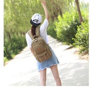 Khaki canvas backpack for outdoor use, large capacity design with multi-layer zipper pockets