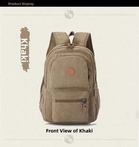 Front view of khaki canvas backpack featuring round star patch and zipper pocket detail