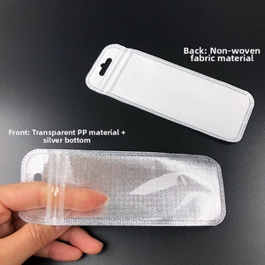 Detail of silver long storage bag with hanging hole and clear window for accessories