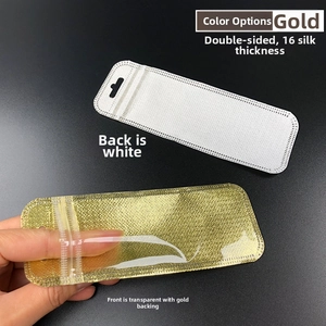 Detail of 16-wire gold ziplock bag with hanging hole and clear window for small jewelry