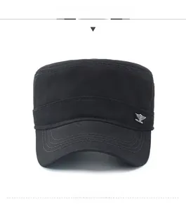 Detail of a black canvas cadet cap featuring a silver eagle metal badge on the side