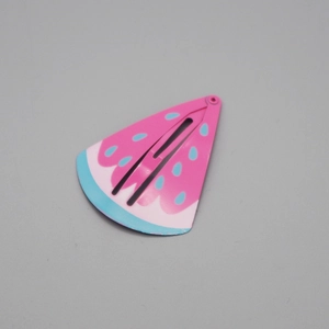 Detailed view of pink and blue watermelon shaped metal snap clip for girls