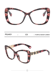 Detailed view of cat eye glasses frames with purple bean flower texture and gold metal accents