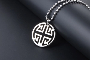 Close-up of a silver hollow geometric circle pendant necklace with a vintage bead chain