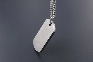 Brushed silver titanium steel rectangle pendant necklace with pebble-edge design detail