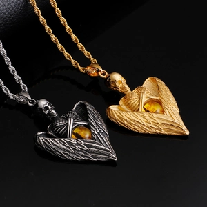 Gothic skull angel wing necklace with amber gemstone in gold and silver steel finish