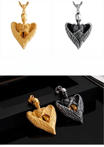 Detail of gothic skull angel wing pendants in golden and steel finishes with gemstone