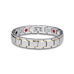 Close-up of titanium steel bracelet with gold accents and embedded magnetic therapy stones