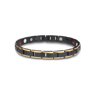 Macro view of two-tone black and gold stainless steel link bracelet with magnetic stones