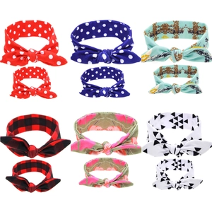 Matching mother and baby headband set with diverse prints including red plaid and floral