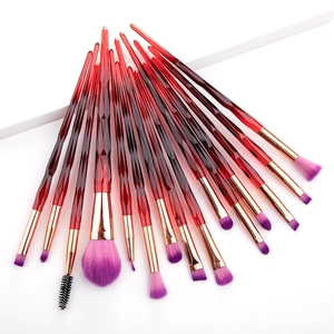 Detail of 15 makeup brushes with red crystal handles and purple gradient soft bristles