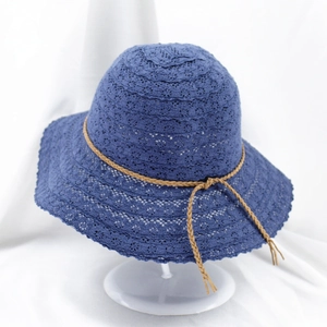Blue lace hollowed knit sun hat with wide brim and decorative bow for beach vacation
