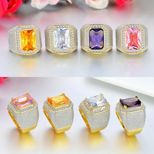 Detail of hip hop style square zircon ring in gold finish with multi-color stones