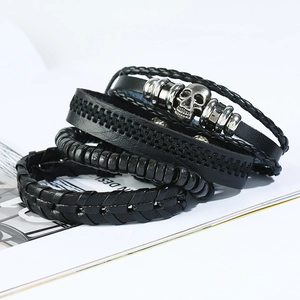 Set vintage punk de 4 bracelets en cuir noir avec breloque crâne argenté et tressage