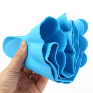 Adjustable blue silicone baby shower cap with ear protection showing soft flexible material