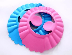 Top view of adjustable pink and blue EVA foam baby shower caps with ear protectors