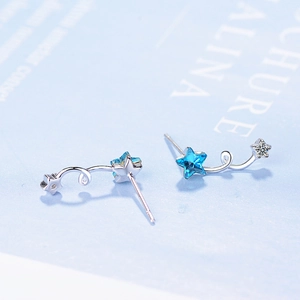 Blue star stud earrings with silver metal and clear crystal meteor trail design