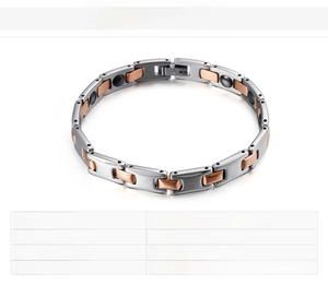 Detail of two-tone stainless steel magnetic therapy bracelet in silver and rose gold finish