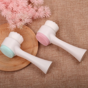 Dual-sided facial cleansing brush with soft bristles and silicone massage pad detail