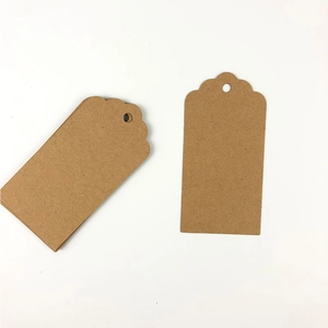 Brown rectangular kraft paper tags with wavy top and pre-punched holes for hanging