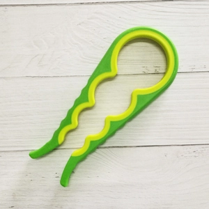 Macro shot of green and yellow non-slip inner grip of the 4-in-1 jar opener tool