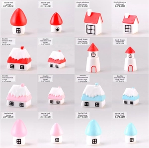 Size comparison chart for Christmas castle and house figurines in various colors and dimensions
