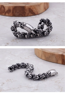 Macro detail of gothic skull chain links and polished clasp on punk style mens bracelet