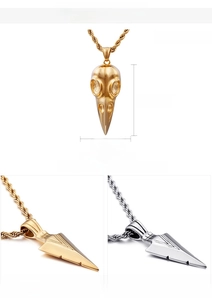 Detailed view of Gothic bird skull pendant with 18K gold plating and 50mm dimensions