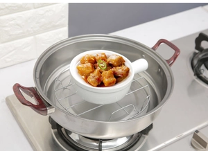 Stainless steel steaming rack inside a pot showing functional kitchen use for cooking food