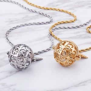 Gold and silver hollow sphere diffuser necklaces with intricate angel wing wing charms