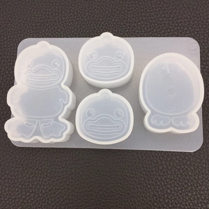 Detailed macro view of 4-style cartoon duck silicone molds for DIY crystal epoxy resin