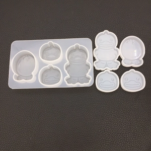 Detailed macro view of duck and eggshell shaped silicone molds for DIY resin crafts