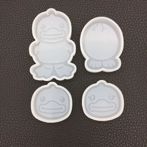 Macro detail of a 4-piece set of cartoon duck silicone molds for resin casting and DIY crafts