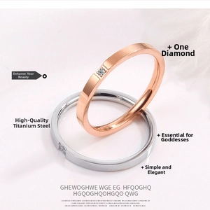 Macro shot of rose gold and silver titanium steel rings with single diamond setting