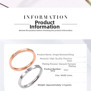 Detail view of 2mm titanium steel ring with single cubic zirconia in rose gold and silver